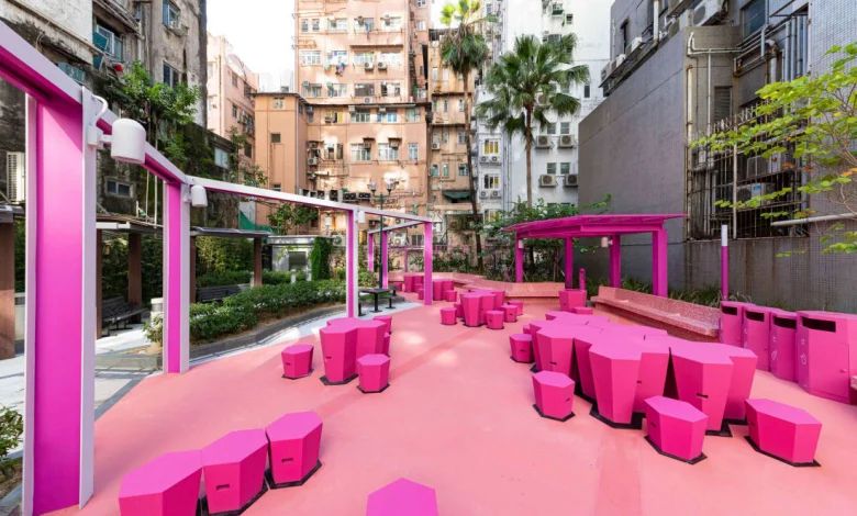 a pink outdoor seating area with persony chairs and tables